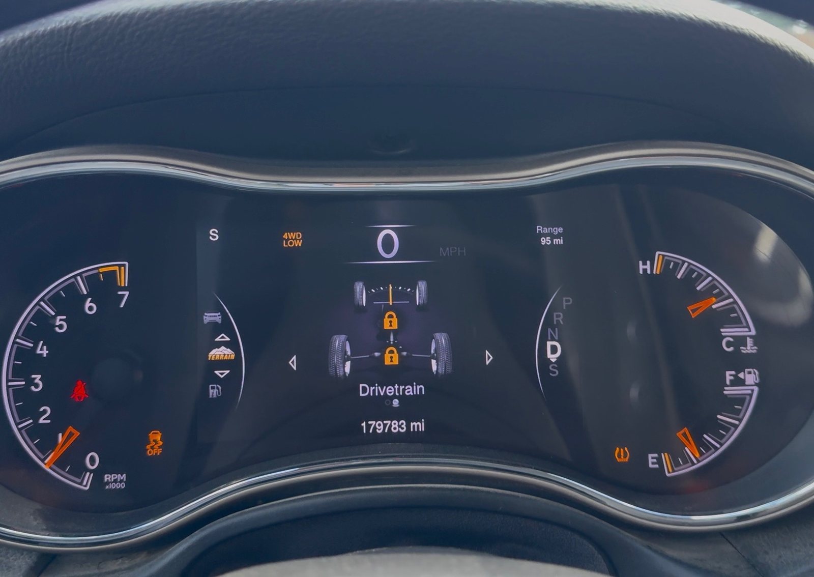 Instrument cluster showing 4WD LOW with both centre and rear differential lock icons illuminated