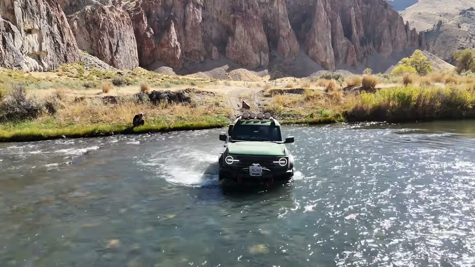 The Bronco pushing through the water