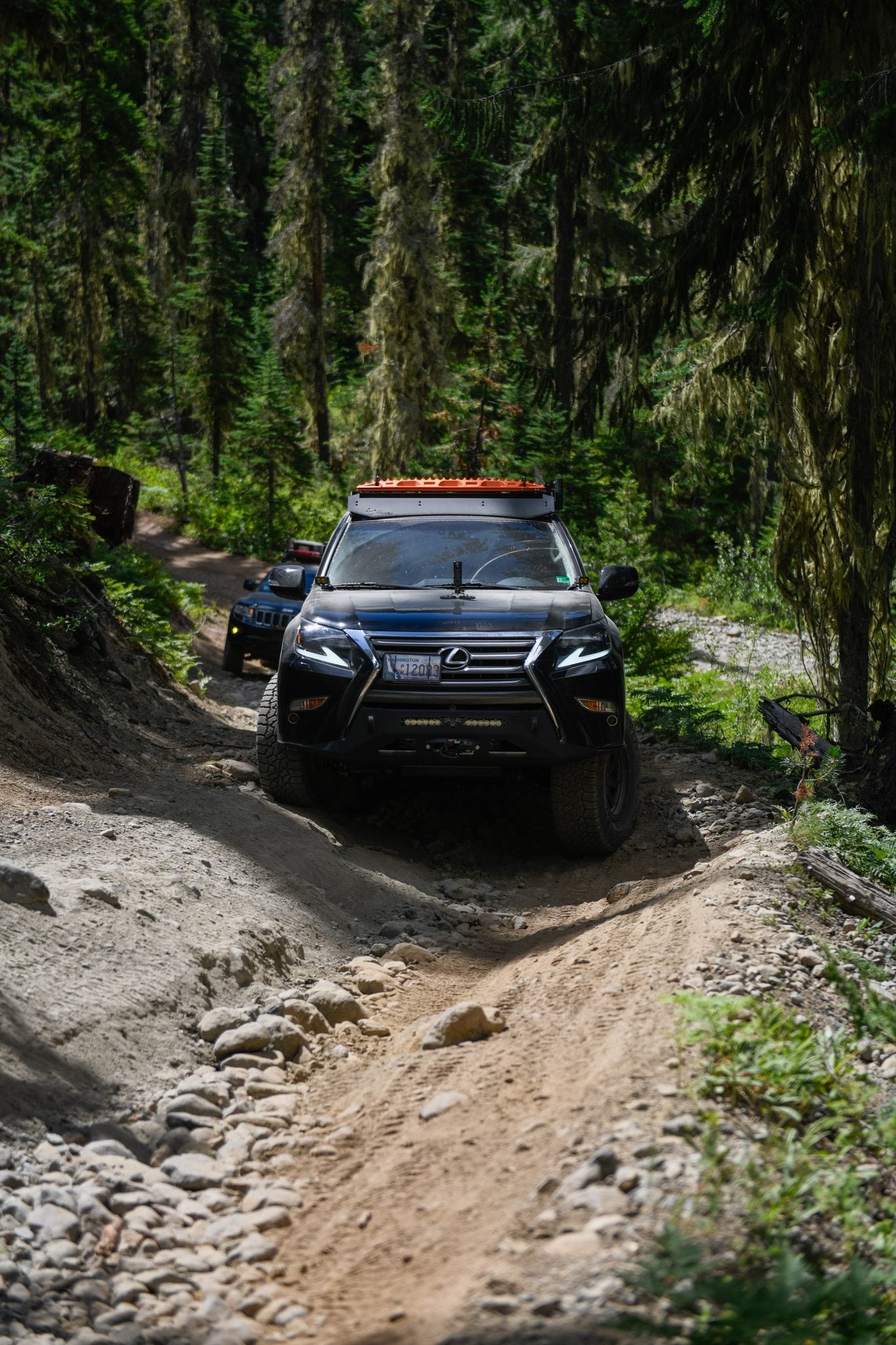 The GX 460 through a washed-out section, front end articulating